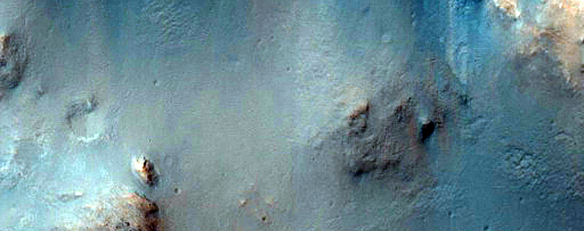 Dark-Toned Material in Terra Tyrrhena Crater Rim