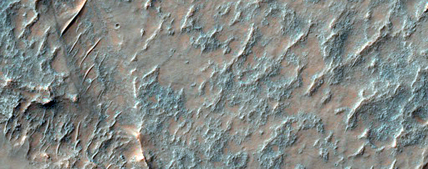 Olivine-Rich Unit Interrupting Wrinkle Ridge in Thaumasia Planum