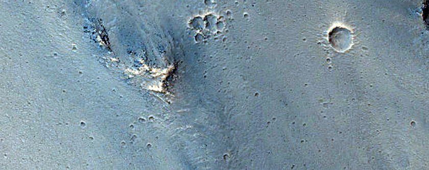 Possible Pyroxene-Rich Outcrops on Ius Chasma Wall and Floor