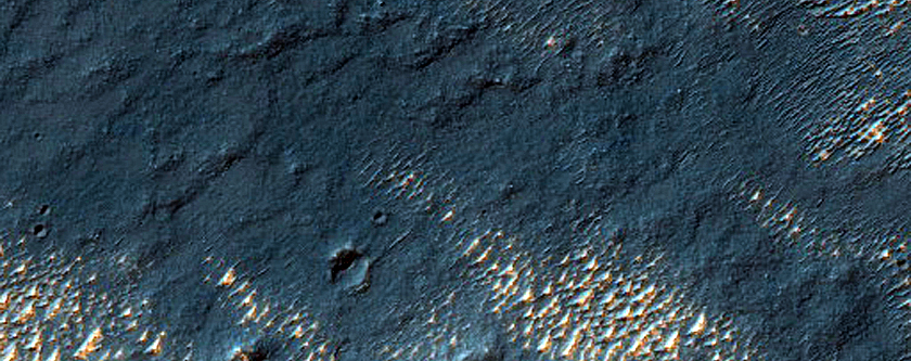 Bright Deposits and Channels in Thaumasia Planum