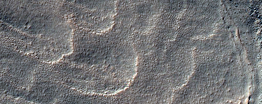Crater with Dark Ellipsoid Ejecta Blanket
