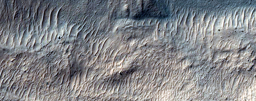 Crater Cut by Trough in Sirenum Fossae