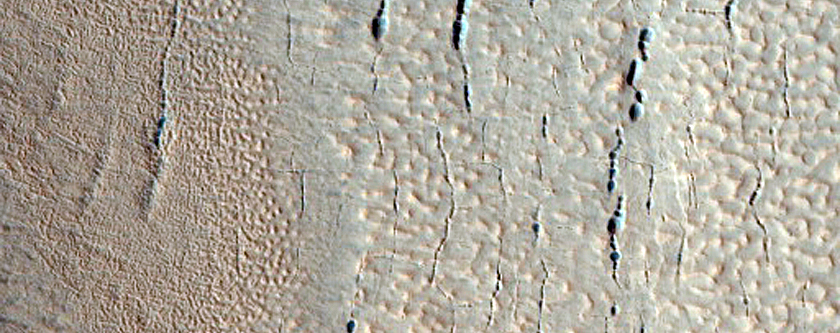 Pits near Ridge and Trough Terrain  in Protonilus Mensae