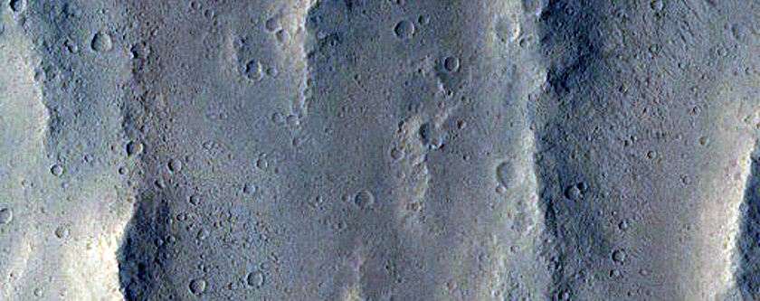 Candidate Recent Impact Site with Bright Material in Sacra Sulci