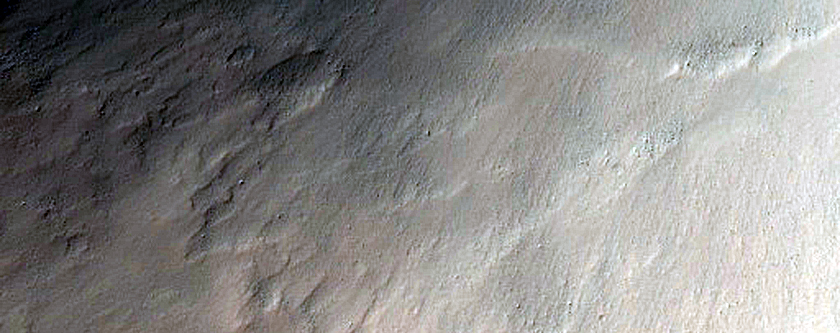 Possible Hydrated Materials around Solis Planum Impact Crater