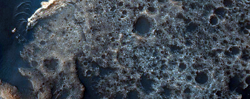 Dunes and Light-Toned Rock Outcrop in Trouvelot Crater