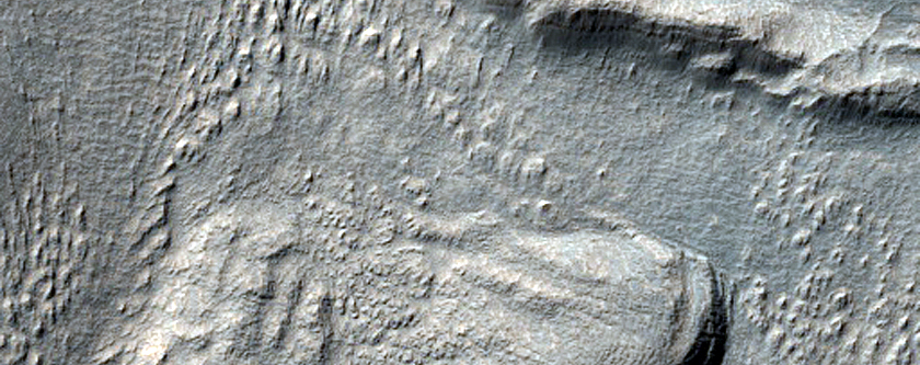 Layered Deposit in Crater near Reull Vallis