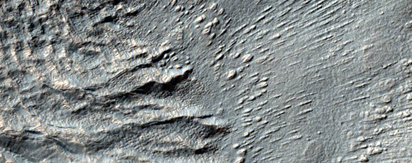 Layers on Crater Floor near Centauri Montes