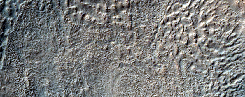 Crater with Brain Terrain for Ejecta near Reull Vallis