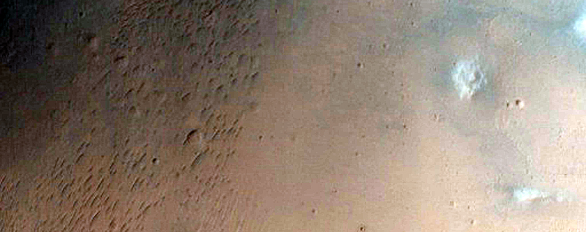 Impact Crater Exposing Bedrock