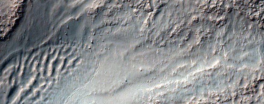 Source of Stratified Fan Material in Baltisk Crater