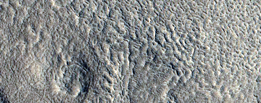 Layered Deposit in Crater near Galaxias Fossae