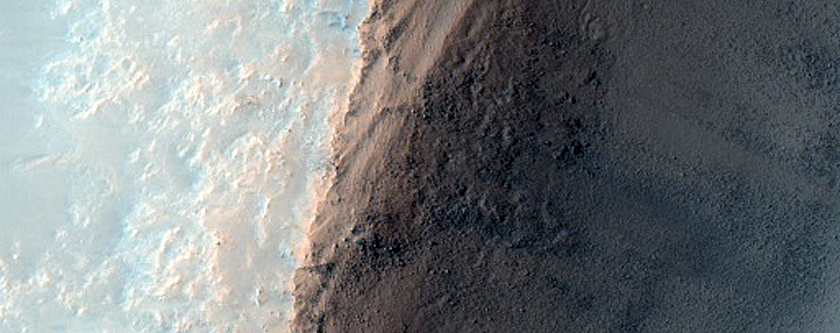 Crater and Possible Olivine-Rich Terrain on Plains Southwest of Toro Crater