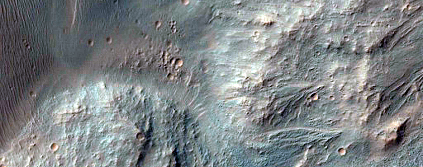 Well-Preserved 6-Kilometer Impact Crater South of Eos Chasma