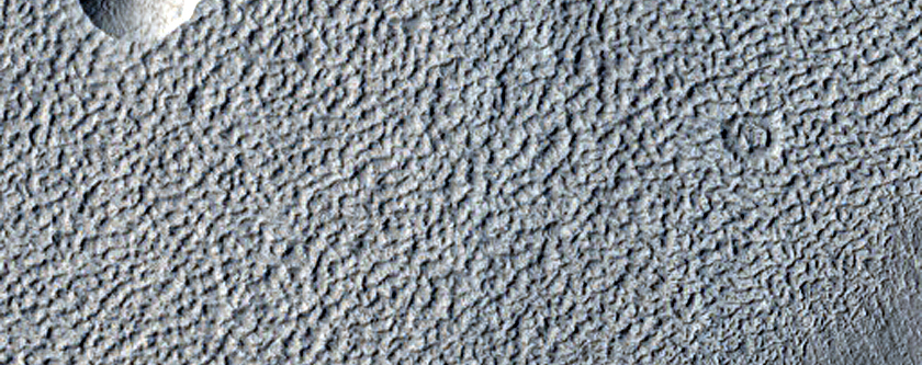 Possible Ice at Base of Fresh Crater in Concentric Crater Fill