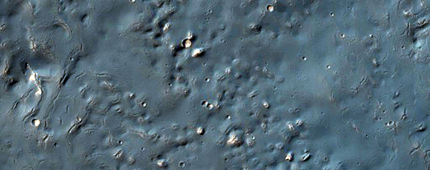 Bright Exposures in Northeast Thaumasia Region