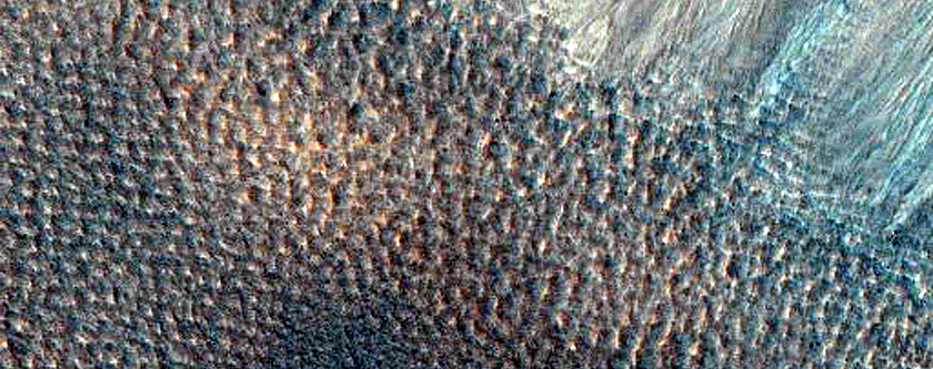 Possible Gully-Associated Light-Toned Materials near Acidalia Planitia