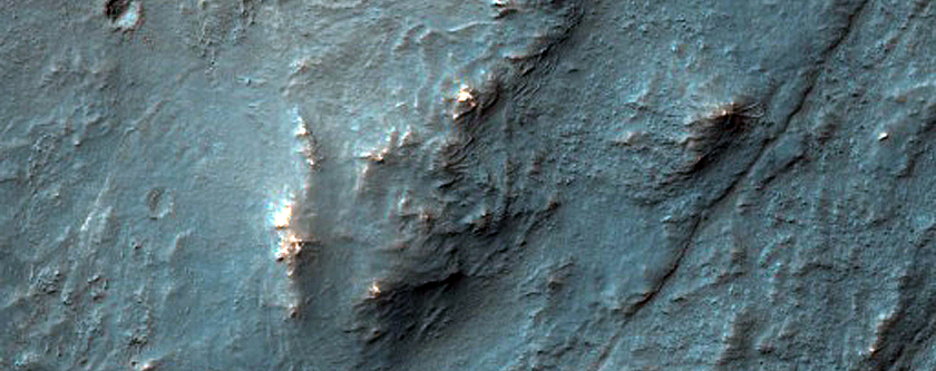 Olivine-Rich Materials on Eastern Flank of Thaumasia Planum