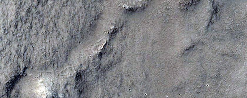 Pitted Cones Intersected by Lobate Contact