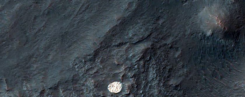 Bright and Round Deposit in Eos Chasma