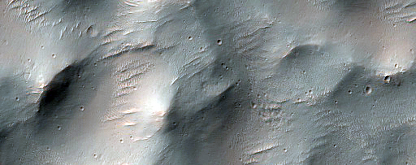Pits in and near Crater Ejecta in Noachis Terra