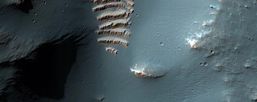 Bright Blocks in Channels near Aniak Crater