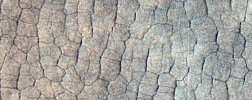 Layers around Crater in Far Western Utopia Planitia