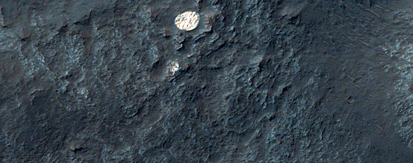 Bright and Round Deposit in Eos Chasma