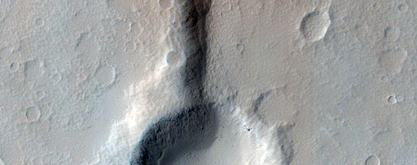 Crater Intersecting Ridge East of Elysium Mons