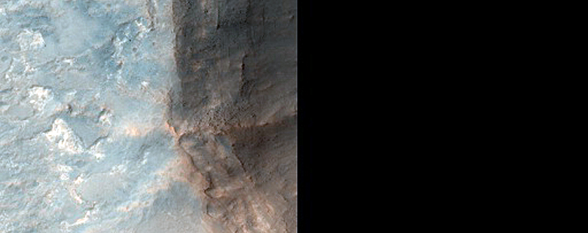 Crater Exposing Bright White Deposits in Oxia Planum Landing Site 