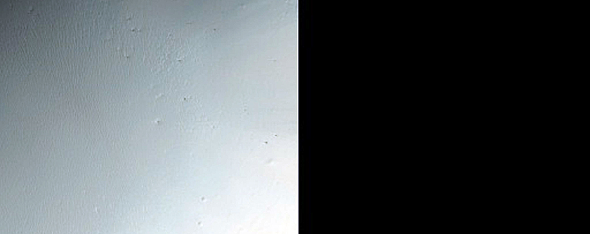 Phyllosilicate-Rich Terrain Exposed by Small Crater Outside Lopez Crater