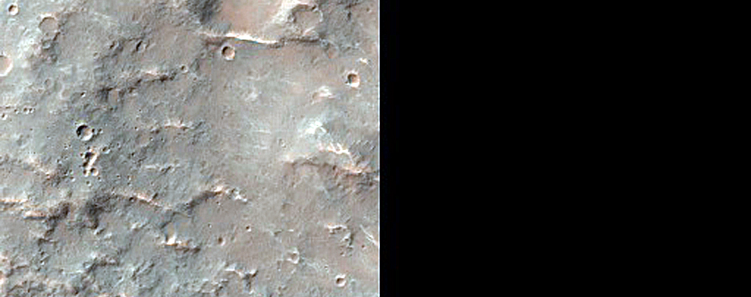 Crater and Channel in Low Southern Latitudes