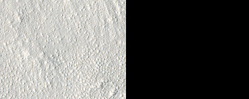 Cones and Irregular Terrain East of Erebus Montes