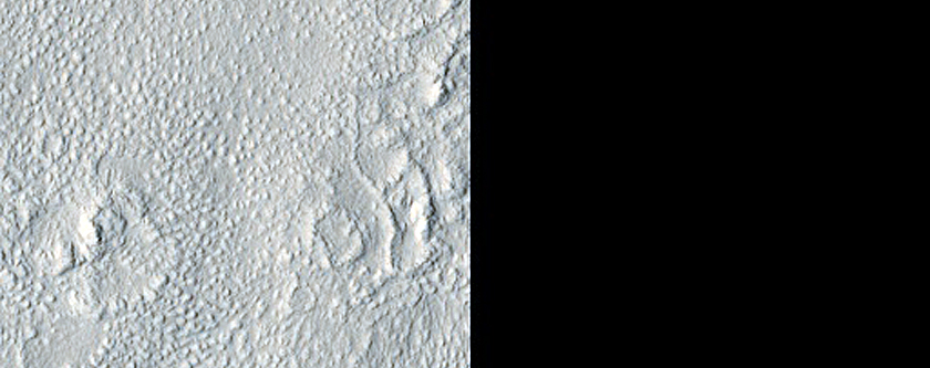 Cones and Irregular Terrain East of Erebus Montes