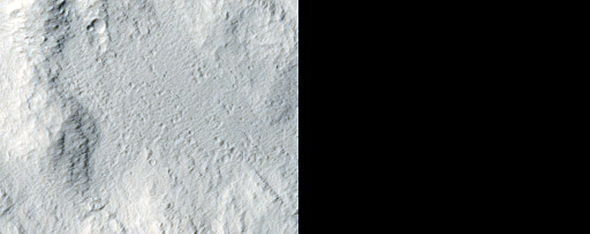 Possible Multidirectional Flow Features Southeast of Canala Crater