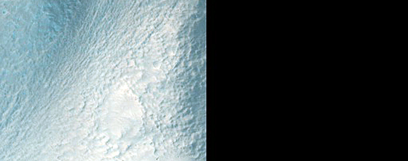 Apron and Mass Movement Material in Crater on Northwest Rim of Terby Crater