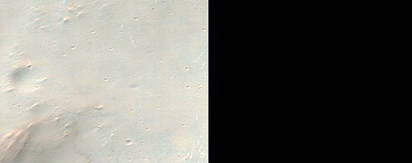 Light-Toned Deposits along Upper Walls of Crater