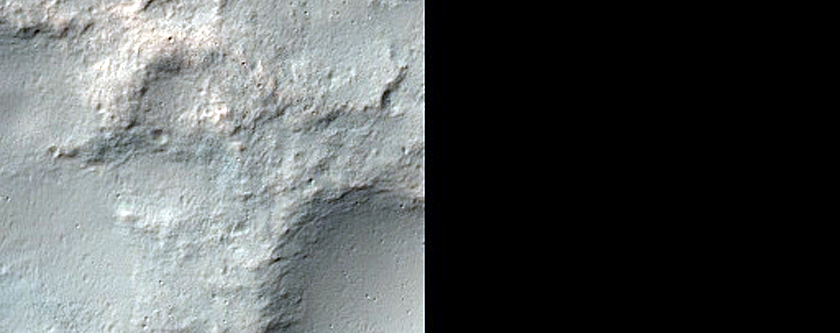 Small Pit Crater Chain and Exposures of Light-Tone Unit