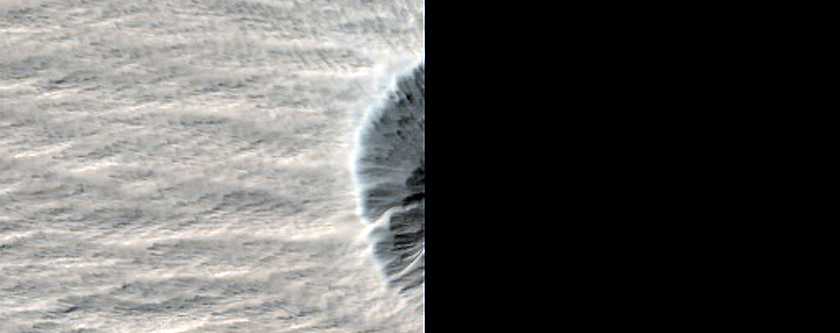 Well-Preserved Crater near New Impact