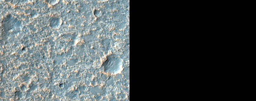 Smooth Dark Patch on Ejecta