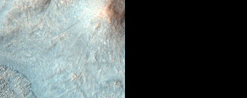 Central Peak and Ring with Megabreccia in 13-Kilometer Diameter Crater