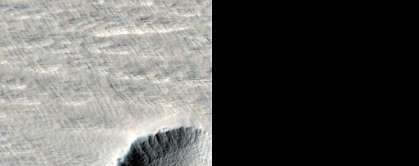 Well-Preserved Crater East of New Impact