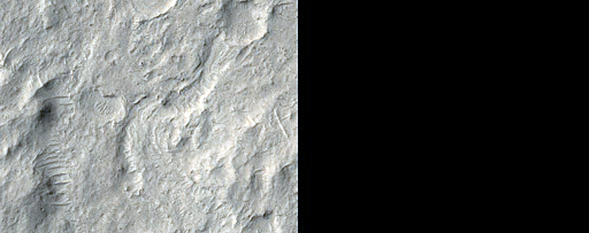 Crater Ejecta Crosscut by Channels in Aeolis Dorsa