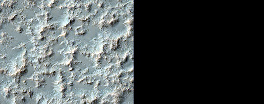 Possible Olivine-Bearing Materials in Eastern Huygens Crater