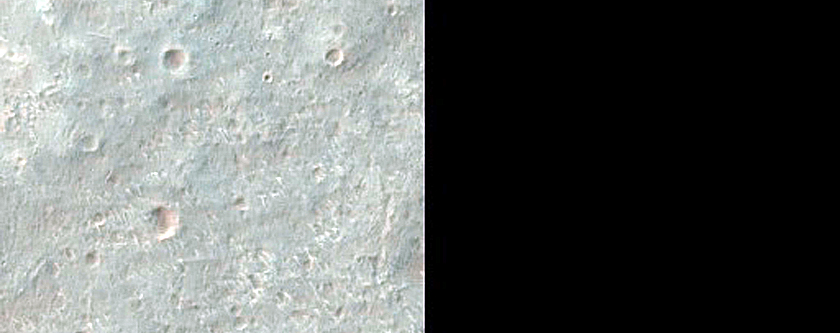 Diverse Minerals near Crater in Terra Tyrrhena