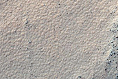 Crater in Aonia Terra
