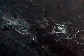 Light-Toned Deposits on Floor of Orson Welles Crater