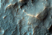 Crater in Crater Exposing Bedrock