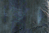 Layers in Crater along West Rim of Tikhonravov Crater