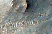 Possible Melt Flows from Oudemans Crater